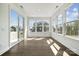 Bright sunroom featuring hardwood floors, large windows, and an abundance of natural light at 2140 Indigo Branch Rd, Indian Land, SC 29707