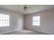 Bright bedroom with neutral walls, carpeting, and ceiling fan at 2406 Faulks Church Rd, Wingate, NC 28174