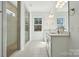 Modern bathroom featuring a double vanity, glass-enclosed shower, and stylish tile flooring at 3112 Beacon Heights Rd, Indian Land, SC 29707
