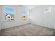 Bright, carpeted bedroom with multiple windows offering abundant natural light and a cozy ambiance at 3112 Beacon Heights Rd, Indian Land, SC 29707