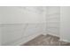 Spacious closet with ample shelving and soft carpet provides plenty of storage at 3112 Beacon Heights Rd, Indian Land, SC 29707