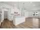 Bright, modern kitchen with white cabinets, stainless appliances, and pendant lighting at 3112 Beacon Heights Rd, Indian Land, SC 29707