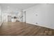 Spacious open-concept living room leading to modern kitchen at 3112 Beacon Heights Rd, Indian Land, SC 29707