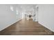 Open-concept living room featuring wood floors and many windows at 3112 Beacon Heights Rd, Indian Land, SC 29707