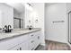 Modern bathroom with double vanity, granite countertops, and modern black fixtures at 4206 Old Monroe Marshville Rd, Wingate, NC 28174