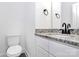 Bathroom with a granite countertop vanity, black hardware and fixtures, and a toilet at 4206 Old Monroe Marshville Rd, Wingate, NC 28174