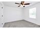 Neutral bedroom boasts a ceiling fan, bright window and closet door at 4206 Old Monroe Marshville Rd, Wingate, NC 28174