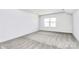 Bright bedroom boasts a vaulted ceiling and natural light from a large window; neutral color scheme at 4206 Old Monroe Marshville Rd, Wingate, NC 28174