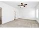 A light-filled bedroom featuring plush carpeting and a ceiling fan at 4206 Old Monroe Marshville Rd, Wingate, NC 28174