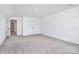 Spacious bedroom offers double door closet, and neutral carpet; doorway visible to hallway at 4206 Old Monroe Marshville Rd, Wingate, NC 28174
