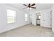 Spacious bedroom with two bright windows and a connecting bathroom at 4206 Old Monroe Marshville Rd, Wingate, NC 28174
