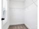 Walk-in closet offers ample storage space with shelving and natural light from window at 4206 Old Monroe Marshville Rd, Wingate, NC 28174