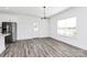 Bright dining area features wood-look flooring, modern lighting, and easy access to both the kitchen and backyard at 4206 Old Monroe Marshville Rd, Wingate, NC 28174