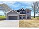 Charming two-story home features a two-car garage, welcoming porch, and modern exterior paint at 4206 Old Monroe Marshville Rd, Wingate, NC 28174