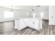 Open-concept kitchen with a large center island, granite countertops, and modern cabinetry at 4206 Old Monroe Marshville Rd, Wingate, NC 28174