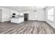 Bright kitchen boasts white cabinets, stainless steel appliances, and a granite island, seamlessly blending style and functionality at 4206 Old Monroe Marshville Rd, Wingate, NC 28174