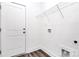 Utility room featuring a wired rack and vinyl flooring at 4206 Old Monroe Marshville Rd, Wingate, NC 28174
