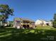 View of backyard featuring a wooden deck and patio, with ample space for outdoor activities at 59 Browning Dr, Taylorsville, NC 28681