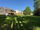 Expansive backyard with a wooden deck, ideal for outdoor entertaining and relaxation at 59 Browning Dr, Taylorsville, NC 28681