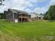 Exterior showcasing back of home with deck overlooking spacious, well maintained backyard at 59 Browning Dr, Taylorsville, NC 28681