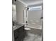 Bathroom with stylish granite countertop vanity and a shower-tub combo at 59 Browning Dr, Taylorsville, NC 28681