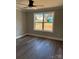 Bright bedroom with ceiling fan and large window overlooking the new construction site at 59 Browning Dr, Taylorsville, NC 28681