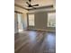 Light-filled primary bedroom featuring hardwood floors, and ensuite bathroom at 59 Browning Dr, Taylorsville, NC 28681