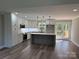 Bright kitchen featuring an island, stainless steel appliances, and access to the deck at 59 Browning Dr, Taylorsville, NC 28681