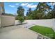 Small backyard with artificial turf, stone, and a fence at 769 River Park Rd, Belmont, NC 28012