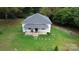 Aerial view of a house with a gray roof and a large yard at 113 Fairview St, Clover, SC 29710