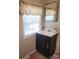 Bathroom features a vanity with a mirror and a window at 113 Fairview St, Clover, SC 29710