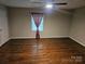 Spacious bedroom features hardwood floors, ample natural light, and neutral walls, creating a serene atmosphere at 113 Fairview St, Clover, SC 29710
