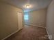 Neutral bedroom featuring wall-to-wall carpet and a closet at 113 Fairview St, Clover, SC 29710