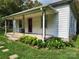Charming single-story home featuring a covered porch, landscaped front yard, and a welcoming entrance at 113 Fairview St, Clover, SC 29710