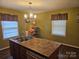 Bright kitchen with stainless appliances, island with sink, and natural light from the dual windows at 113 Fairview St, Clover, SC 29710