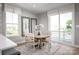 Bright dining area with table and chairs near sliding doors at 2837 Statesville Ave, Charlotte, NC 28206