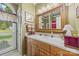 Bathroom featuring a vanity with wooden cabinets and a white countertop with an ornate mirror above at 102 Sleaford Ct, Dallas, NC 28034