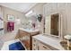 Bright bathroom featuring a wood vanity, mirror, and vanity with drawers at 102 Sleaford Ct, Dallas, NC 28034