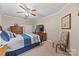Cozy bedroom with comfortable bed, wood furniture, and neutral carpet at 102 Sleaford Ct, Dallas, NC 28034