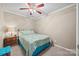 Bedroom featuring a bed with turquoise accents and a nightstand with a lamp at 102 Sleaford Ct, Dallas, NC 28034