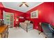 Bedroom featuring a daybed, red walls, carpet and a glimpse into an adjacent room at 102 Sleaford Ct, Dallas, NC 28034