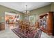 Comfortable dining room with views of the living room, traditional furnishings, and neutral decor at 102 Sleaford Ct, Dallas, NC 28034