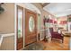 Welcoming entryway featuring a decorative wood door and glimpses of the living room and dining area at 102 Sleaford Ct, Dallas, NC 28034