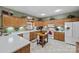 Functional kitchen with wood cabinets, modern appliances, and a central island prep area at 102 Sleaford Ct, Dallas, NC 28034