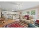 Inviting living room featuring hardwood floors, neutral paint, and a cozy seating area with bright natural light at 102 Sleaford Ct, Dallas, NC 28034