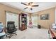 Office space with a large desk chair, built-in shelves, and two windows for natural light at 102 Sleaford Ct, Dallas, NC 28034
