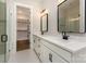 Bathroom featuring double vanities, walk in shower, and a walk-in closet at 1025 Baylor Grv, Monroe, NC 28112