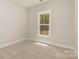 Well-lit bedroom with neutral carpet, perfect for relaxation at 1025 Baylor Grv, Monroe, NC 28112