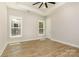 Bright bedroom with ample natural light and a tray ceiling with fan at 1025 Baylor Grv, Monroe, NC 28112