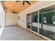 Covered patio features ceiling fans and sliding glass doors for easy access to backyard at 1025 Baylor Grv, Monroe, NC 28112